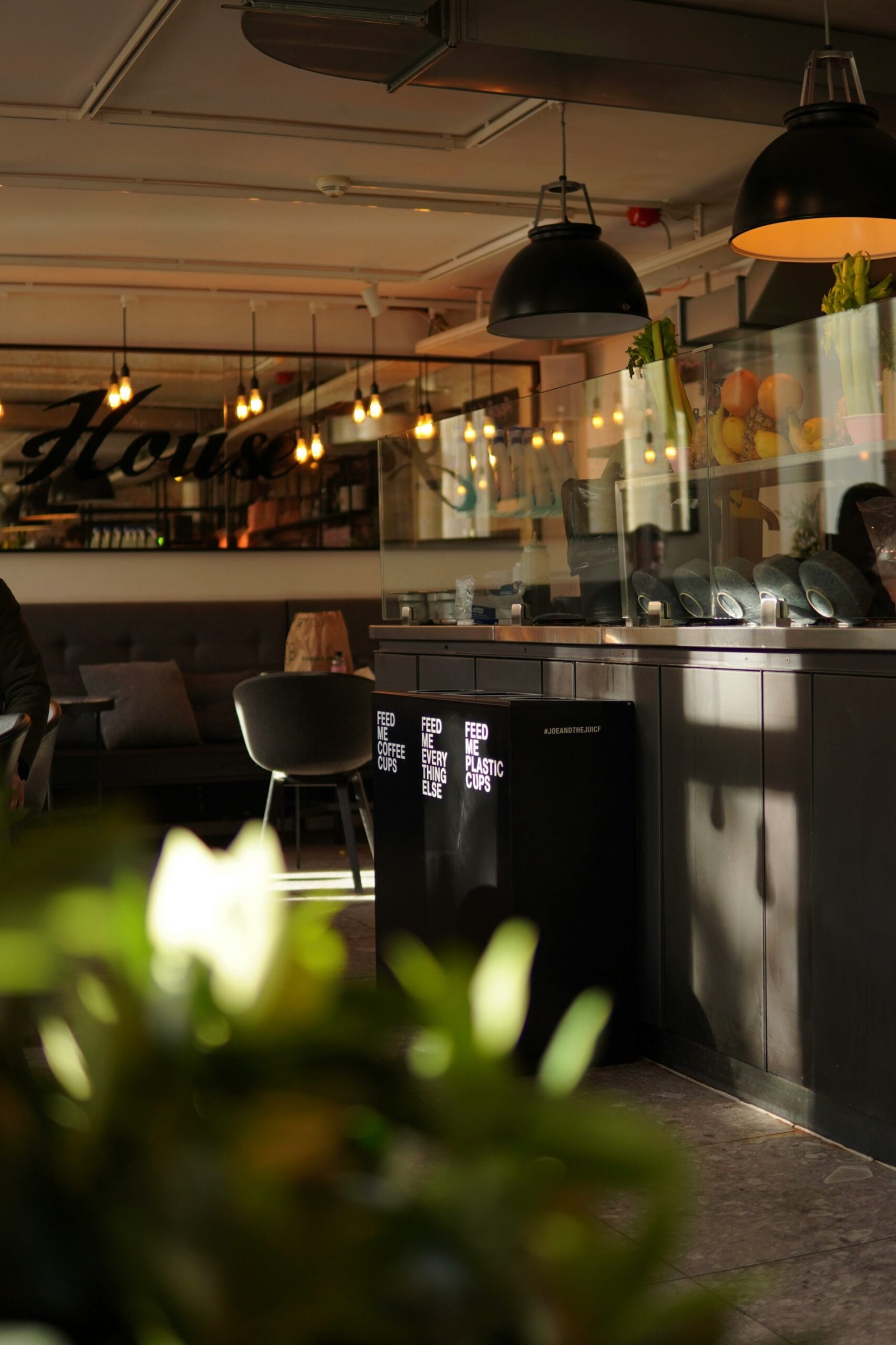 a person sitting at a table in a restaurant